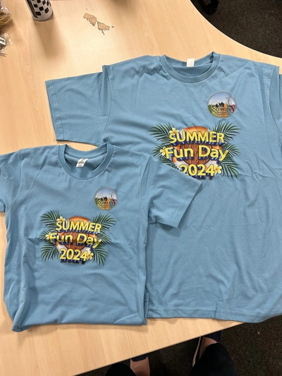 Adult and child custom printed t-shirts for Cowley Summer Fun Day 2024 - full-colour DTG event t-shirts delivered across London and Essex by Furnival Press