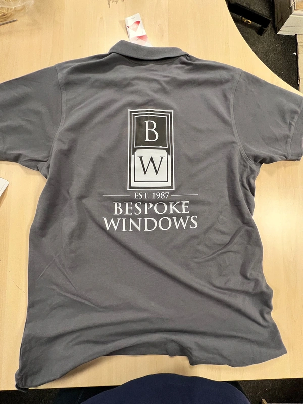 Back of grey polo shirt with full-colour Bespoke Windows branded print — custom workwear by Furnival Press, South Essex